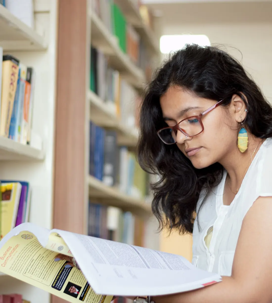 Student reading in the library