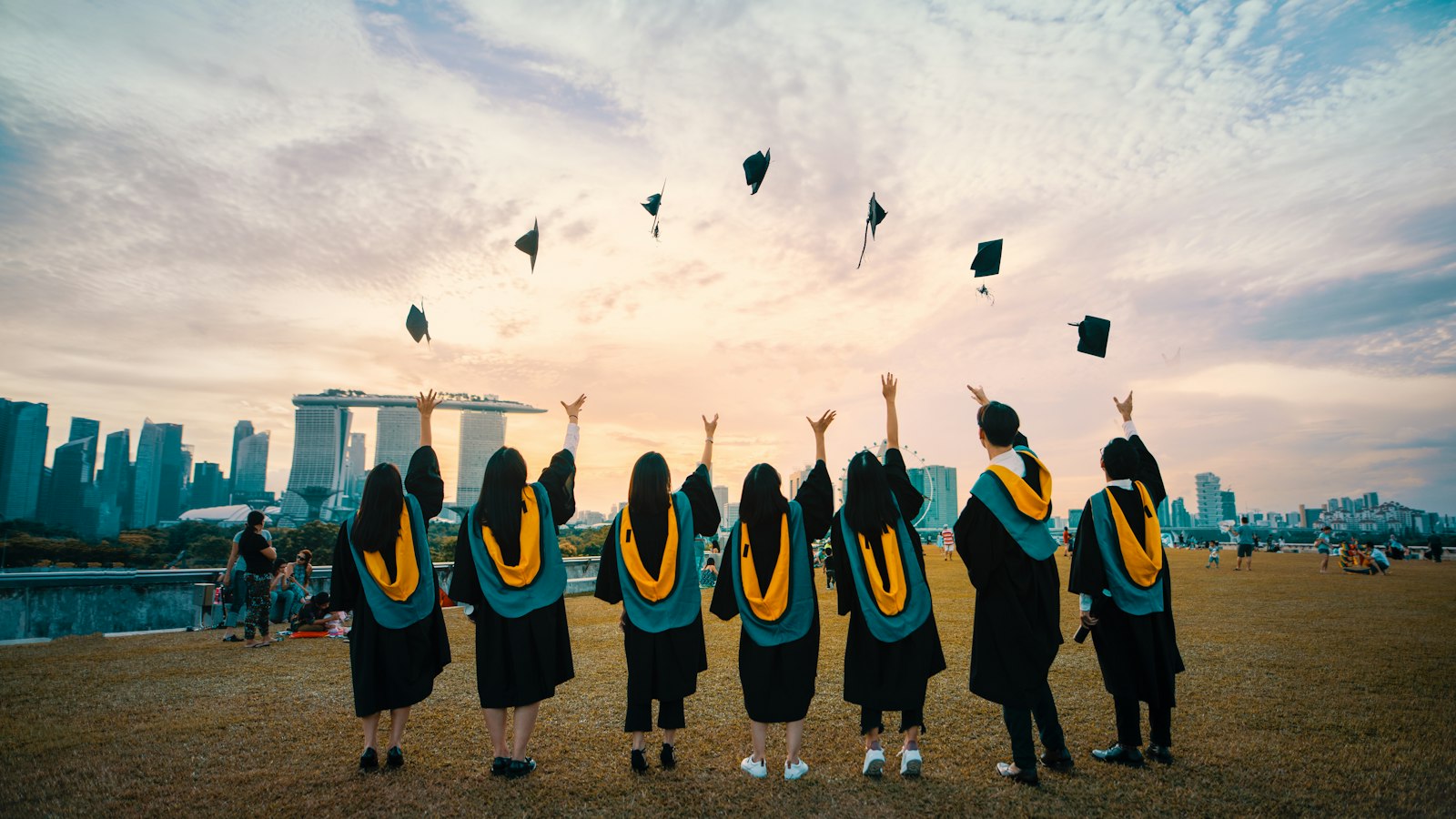 Graduates throwing caps in celebration